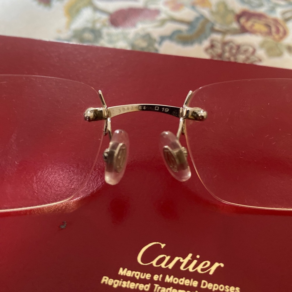 Cartier glasses. Brown buffs.